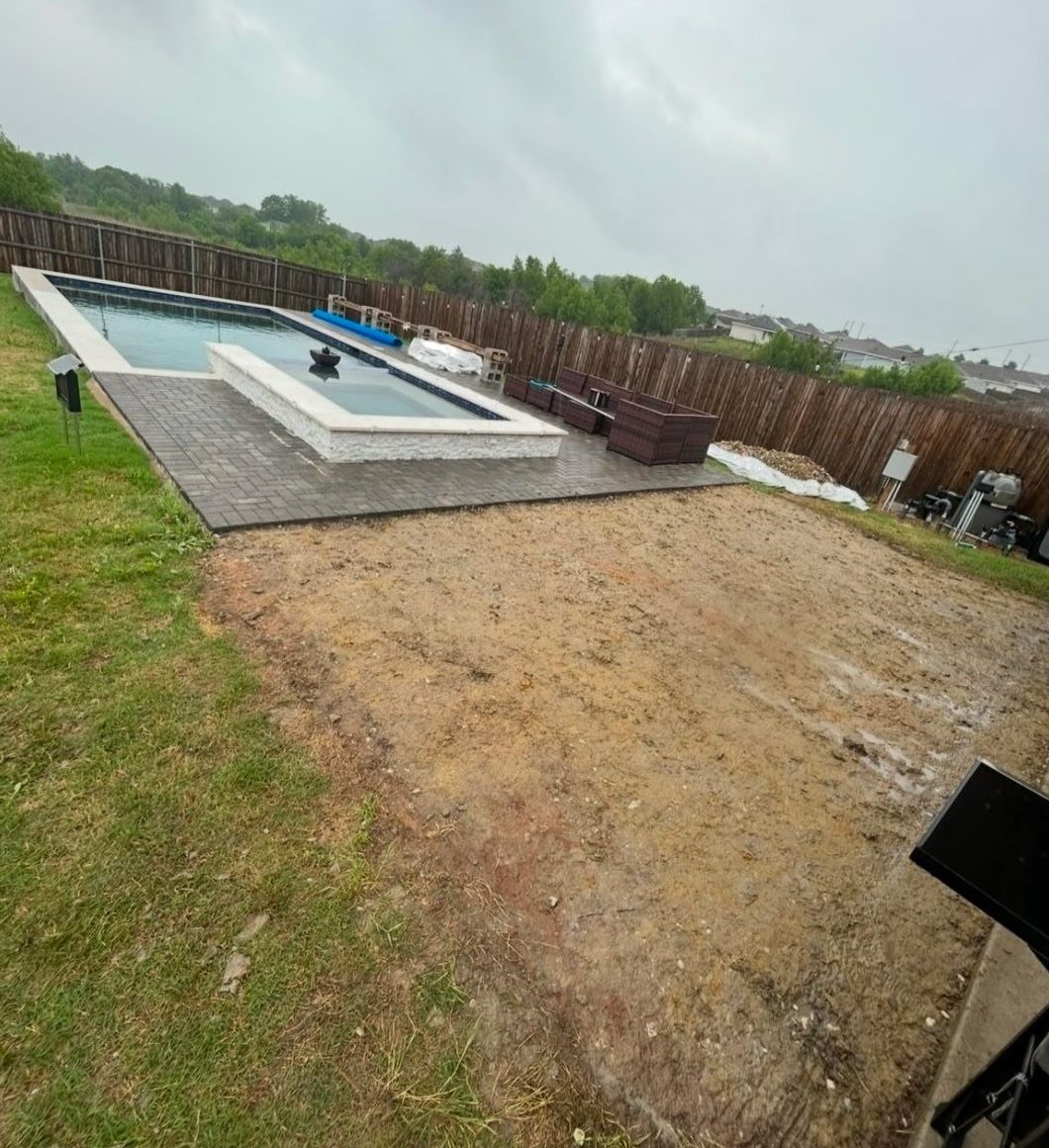 Pool-area paver patio — before Pro Turf Landscaping started